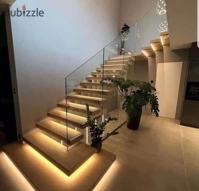 Duplex with private garden, ready for immediate occupancy, in a strategic location in New Cairo's Fifth Settlement, within Creek Town Compound.