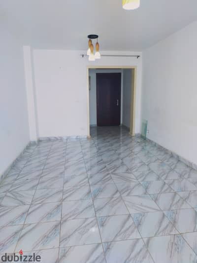 Apartment for rent in Madinaty 107 meters in B2, 15 thousand required, two bedrooms, bathroom, kitchen, reception, garden view, steps from all services, viewing at any time, fully serviced, electricity, water, natural gas, internet, and elevator.