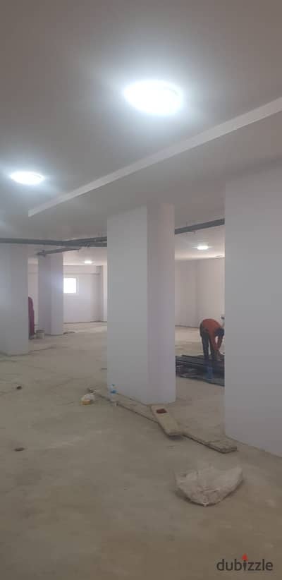 A multi-purpose warehouse for sale in the Fifth Settlement Industrial Area. The land area is 700 square meters, and the building is fully constructed
