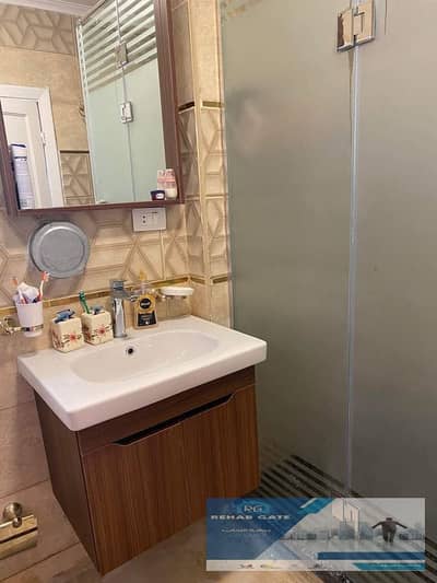 For sale in Al Rehab, next to Mall 2: a 108-square-meter apartment with premium custom finishes, overlooking the White Garden.