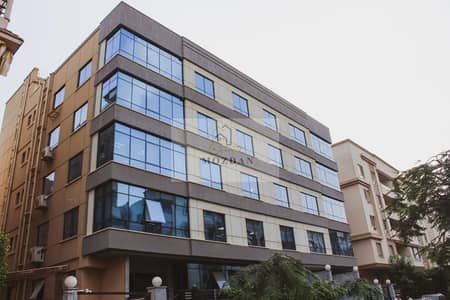 Commercial building for rent, ground floor and 6 floors with an area of 2200 meters, high deluxe, first use in New Maadi