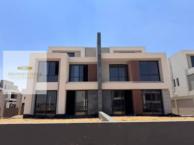 Villa for sale in Al Patio Town compound next to the American University with full finishing direct on Gamal Abdel Nasser Axis