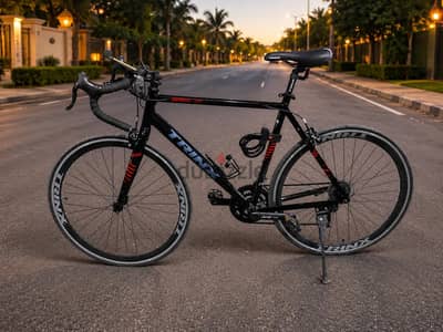 Trinx Road MG7 يوجد قفل واير وحامل زجاجة وكشاف بطارية ليثيوم
