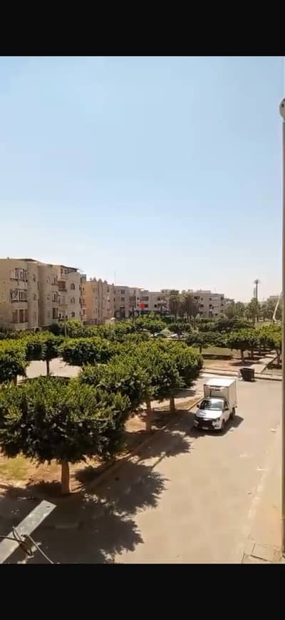 Apartment in Al Obour City, in the first district, local 8, on the second floor, with a completely finished balcony, two bedrooms, a bathroom, a kitchen, and a wonderful view of a large garden.