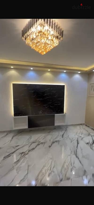 Apartment for sale at Al-Juman Towers in the Seventh District next to a Saudi location in Sheikh Zayed, fully finished with ultra-super lux specifications.