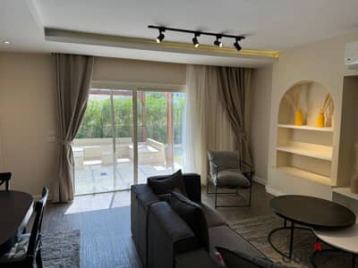 fully furnished apartment with private garden at new cairo  3 bedrooms and 2 bathrooms