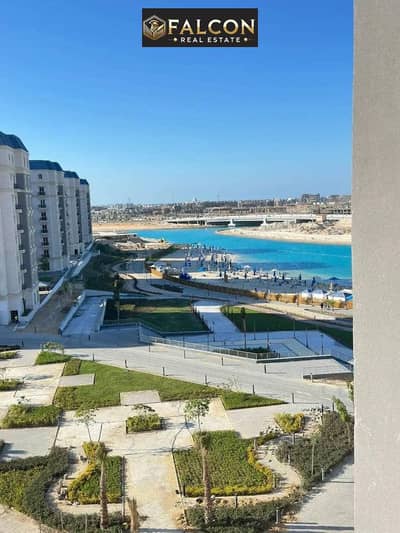 Own a first-row beachfront apartment with VIP finishing for sale in New Alamein, near Marassi, Hacienda Bay, and Marina North Coast.