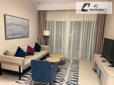 A fully furnished hotel style apartment complete with air conditioning and a kitchen equipped with appliances—available for resale at Marina View