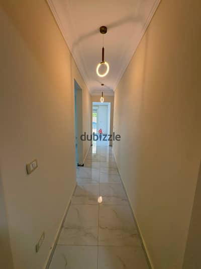 Apartment for rent 135m in Sarai Compound, Fifth Settlement, ground floor with a 200m garden, 2 bedrooms, 3 bathrooms, fully air-conditioned and has shutters,