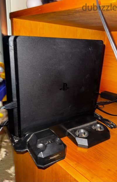 PS4 Slim 1TB excellent condition controllers and 4 games