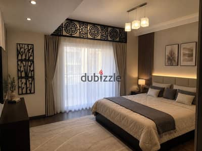 Furnished hotel apartment in a new building with a garden view on Karim Benone Street, steps from the main street and 9 Street, fully equipped with air conditioning and a garage, high super lux