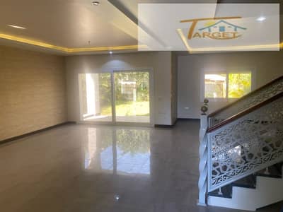 Villa for rent in Madinaty, Model J, modern style, ultra-super-lux finishes, including a kitchen; view of the flood channel.