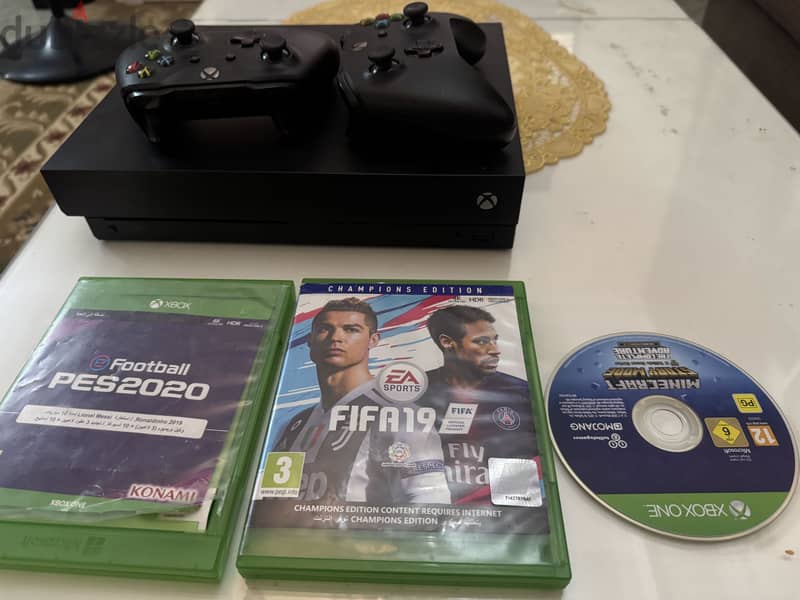 Xbox one x with 2 controllers 3