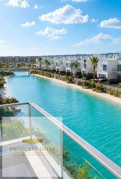 For the price of a chalet, receive a villa with 4 rooms, Crystal Lagoon view, at Private Beach, fully finished - Naya Bay - Ras El Hikma - North Coast