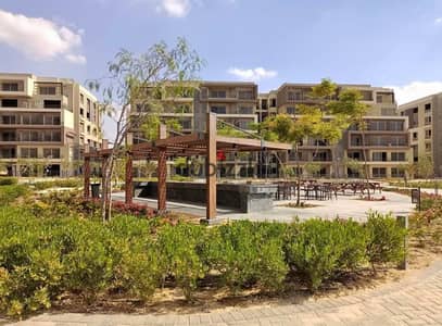 A fully finished, 3-bedroom apartment with a direct lagoon view is for sale at a price lower than the developer's price in Palm Hills Compound, Fifth