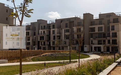 Two-bedroom apartment for sale with complete finishing in Sodic East Compound, Al-Shorouk City with easy payment installments and a distinctive view of green spaces
