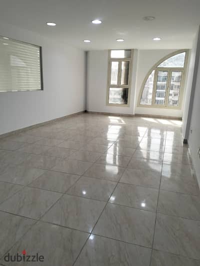 Office for rent in Heliopolis on a main street, area 330 meters, prime location, modern building with hotel entrance, 5 minutes to Nasr City and Sheraton, and 15 minutes to the Fifth Settlement, consisting of rooms and open spaces