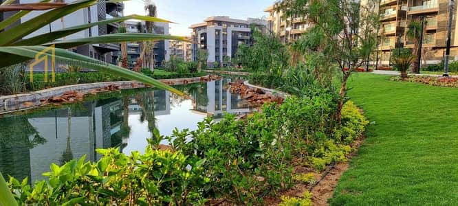 Apartment for sale in Madinaty, ground floor with a garden, area 96+50m, view of the lakes