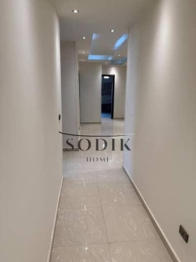 Apartment in the Ninth District near Arts Street, with a Hashemite stone facade and a fully finished marble entrance.