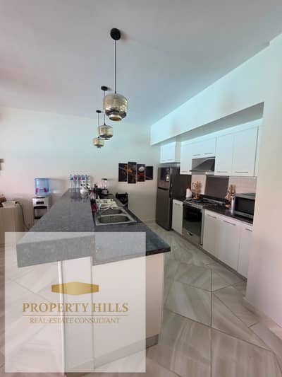 A 128 sqm chalet in Marassi—fully finished and furnished. It features two bedrooms, a prime location directly overlooking the pool, and is just steps