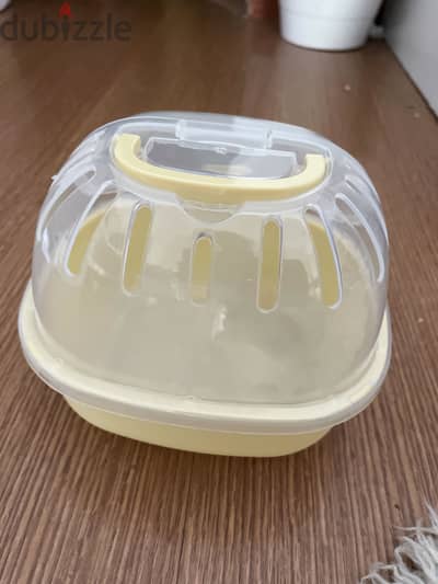 Yellow travel cage for hamsters