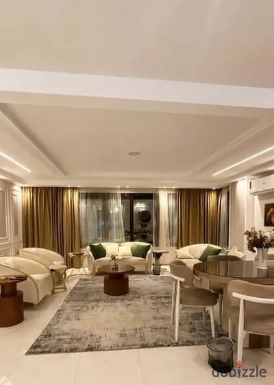 In a new building with new furniture, Al-Said Club on Tahrir Square, an equipped 230m apartment with the latest designs, all appliances are new, hotel-style entrance, 2 elevators, super lux finishing.