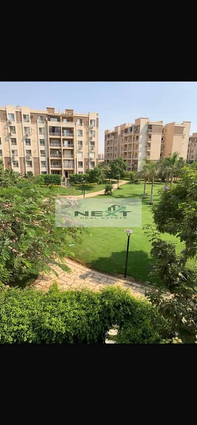 For rent in Madinaty, a new law apartment, 70 sq m, 2 bedrooms + 1 bathroom, company finishing, 5th floor, garden view, one minute from services and t