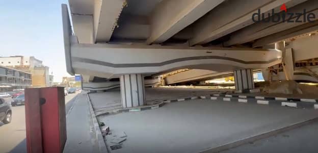 Car showroom for rent, under the bridge area, licensed for a car showroom in the Fifth Settlement, 700 meters