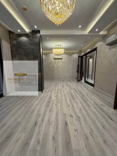 Apartment for sale with a cash discount, fully furnished with air conditioning in the heart of Golden Square and near Mivida Compound