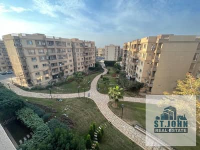 For rent an apartment area 103m Madinaty view wide garden in front of the new strip mall three bedrooms and two bathrooms elevator