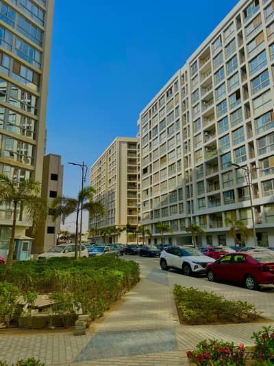 Apartment for sale in Compound One Qatameya 160 m half finishing distinctive tower