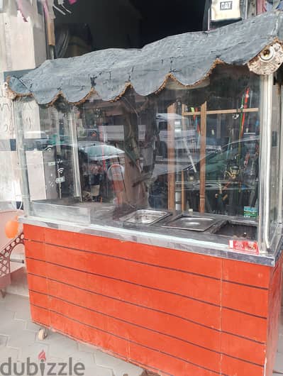 عربيه كبده وسجق وحواوشى فيها بيت نار 4شعله وجريل ودولابين بااقفال زجاج