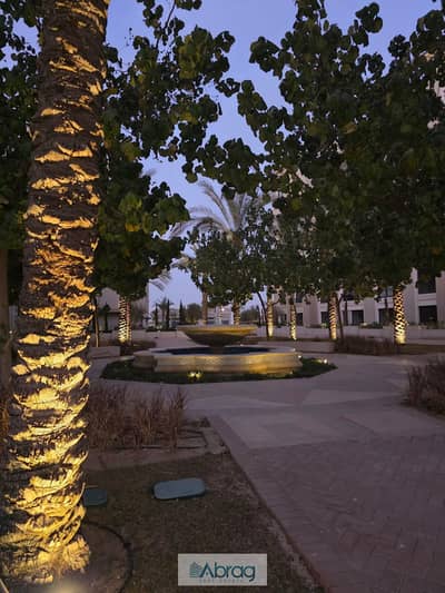 Apartment with garden for sale in village west compound sheik zayed