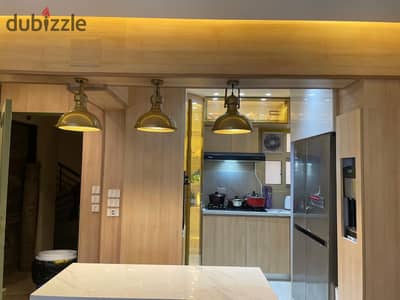 Apartment for sale in Jannah October Compound behind Mall of Arabia  next to the shooting club  area 130 sqm  3 rooms 2 bathrooms super deluxe finishing other than appliance finishing  sale includes kitchen  and built-in
