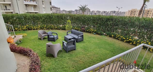 Apartment for rent in The Address Compound, Sheikh Zayed City. 78 sqm interior area with a 120 sqm garden; includes kitchen and air conditioning.