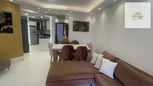 For rent, furnished apartment in Al Rehab, 2 bedrooms, special finishes, wide garden view.