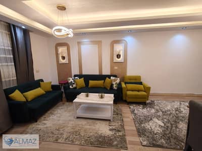 Furnished 120 sqm garden apartment for rent in Gardenia City Zone 10 Compound, Nasr City, near main roads.