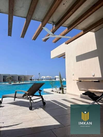 Fully finished chalet for sale overlooking the pool at Direction White Resort, Ras El Hekma (North Coast/Alamein)—10 minutes from Marina 8. Available