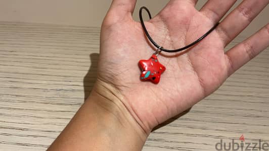 Necklace with a star shaped charm