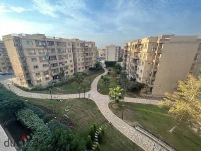 Apartment for rent in Madinaty, Phase B6; 103 sqm, overlooking a garden and a side street.