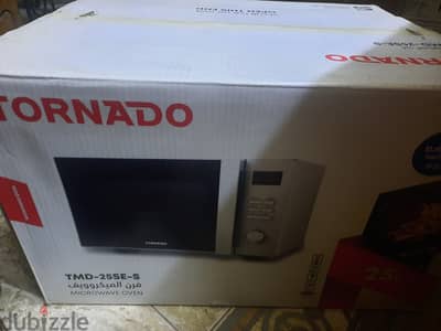 A new microwave with its sealed box for sale