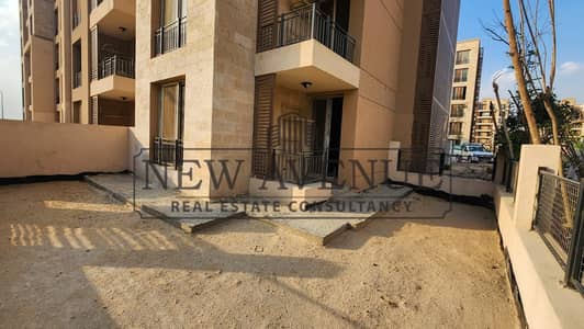 شقة غرفتين ارضي بجنينة كبيرة للبيع فى tag city phase lake park