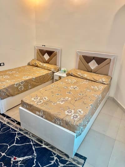 Balcony available for a studio with double room and living room in Sixth of October City, Neighborhood 1, Block 6, Quarter floor, Elevator included, water and electricity card included, balcony directly on the street, close to all services, minutes from Al-Hasri