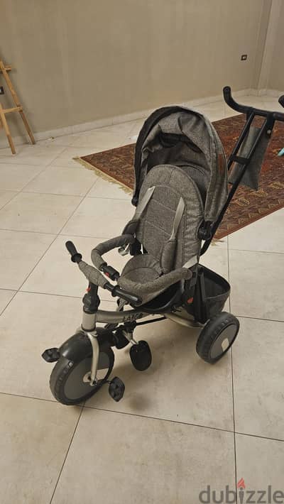 tricycle with a handle to push