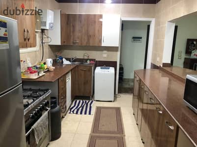 Furnished apartment for rent in the Southern Lotus 165 m ground floor behind the pool directly 3 rooms and 2 bathrooms with American kitchen close to Al-Teseen and service areas