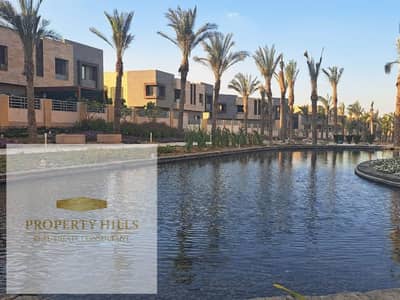 Corner townhouse for sale, fully finished with over 50% cash discount, full landscape view, next to SODIC New Cairo.