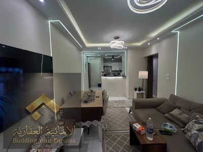 For rent, a fully furnished apartment with excellent furnishings in Al-Nargis Villas 1 - Fifth Settlement, a minute from 90th Street, next to Lake View and Dusit Hotel, and in front of Tulip Club. - 135 meters - first floor - 2 rooms - reception 3 pieces - kitchen and bathroom - super lux finishing - the possibility of adding a third room - parking space and