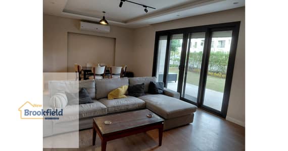 **Fully Furnished Ground Floor Apartment with Private Garden for Rent in District 5 – New Cairo**