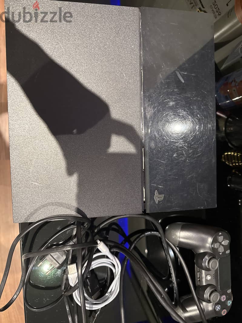 PlayStation 4 with controller and wires 1