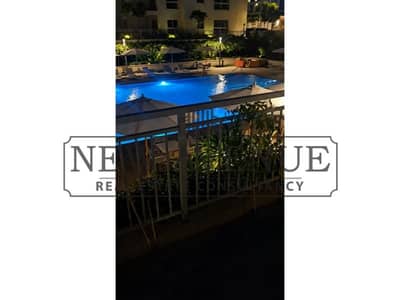 Fully finished Apartment with a private garden direct pool view located in the heart of New Cairo , in a prime location - Mivida